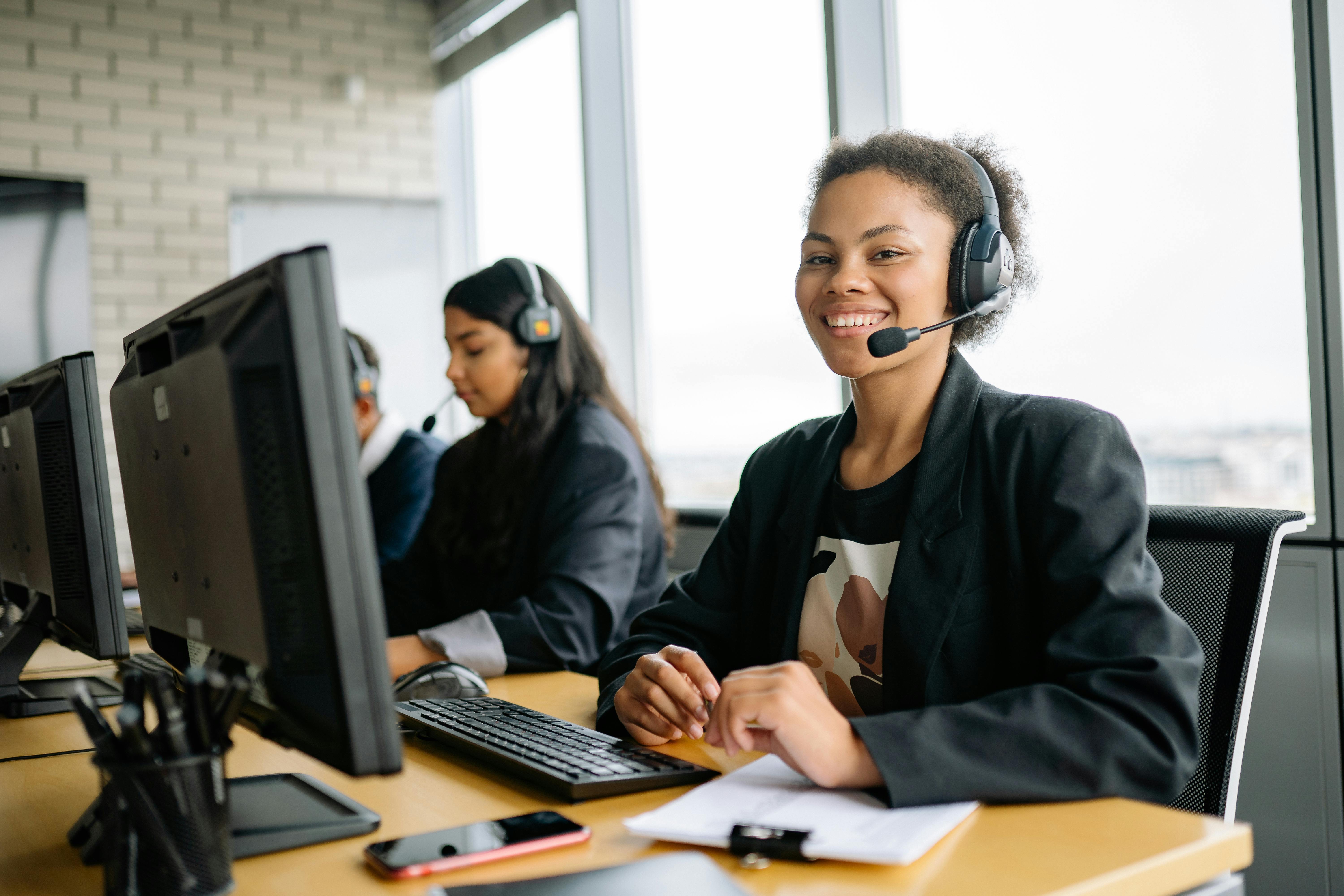 Support team taking phone calls for technical support.