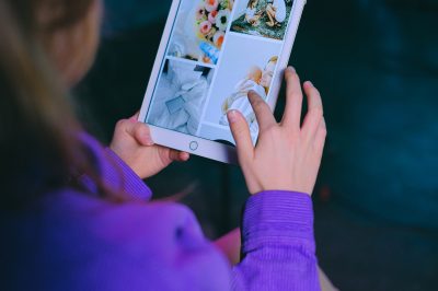 Woman looking at images on tablet